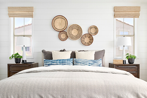 bedroom with woven elements above bed