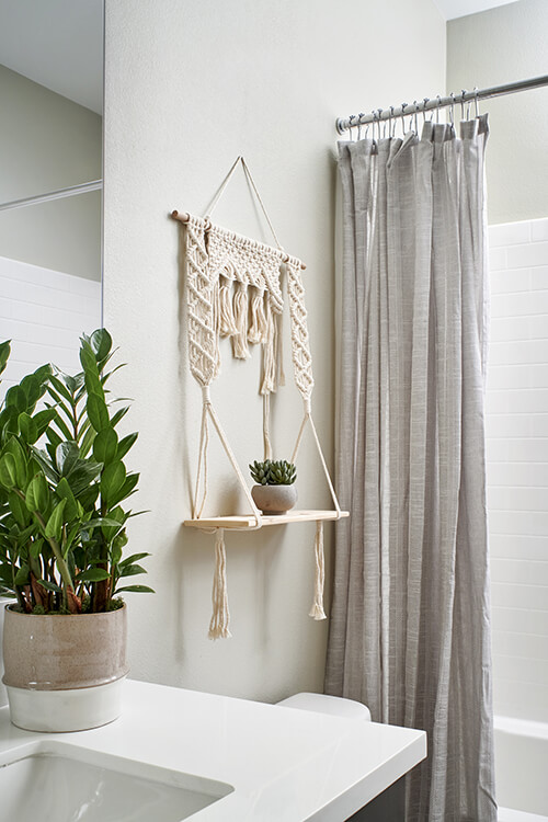 macrame plant holder in bathroom