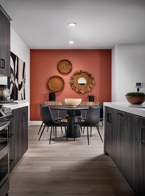 dining area with red statement wall